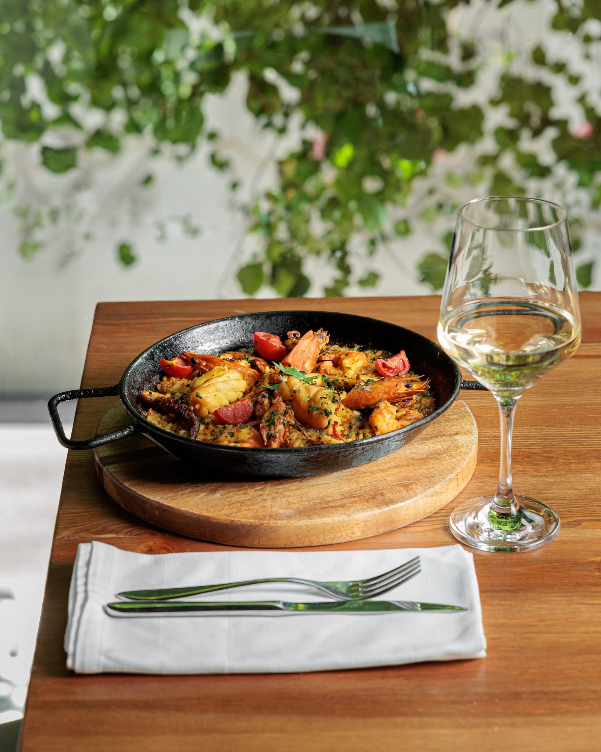 Seafood paella served on the garden terrace at Fresh Garden Restaurant in Tirana